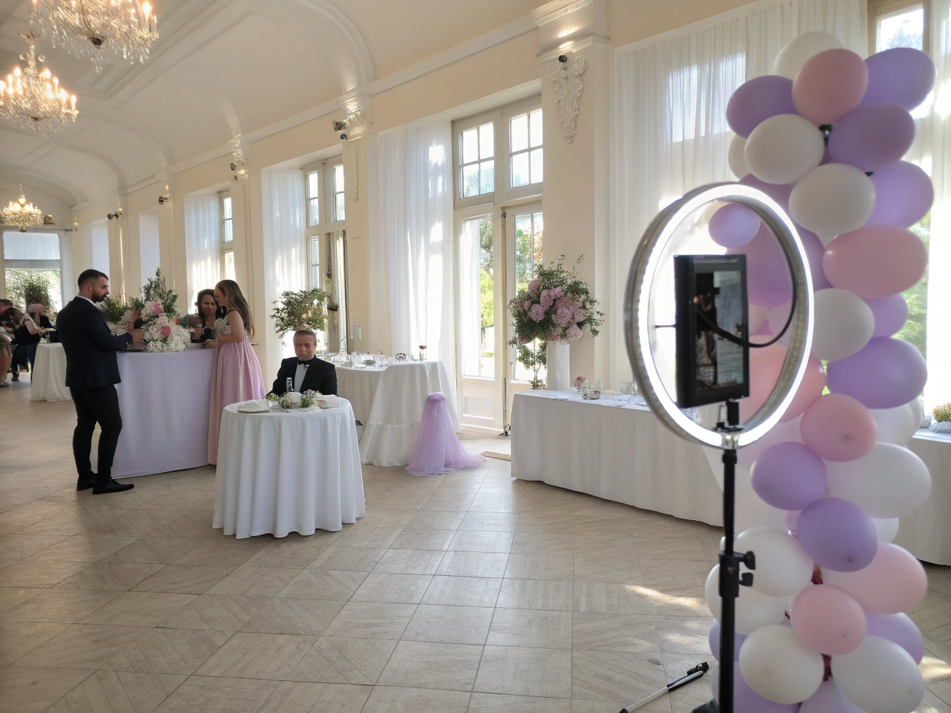 Guests enjoying cocktails and photo keepsakes at a dim candlelit evening reception